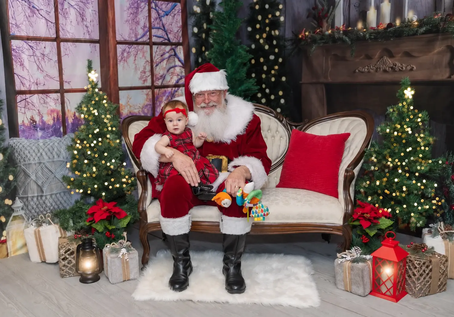 Santa Skip holding a child in a festive portrait scene