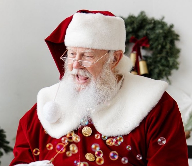 Santa Skip smiling among bubbles