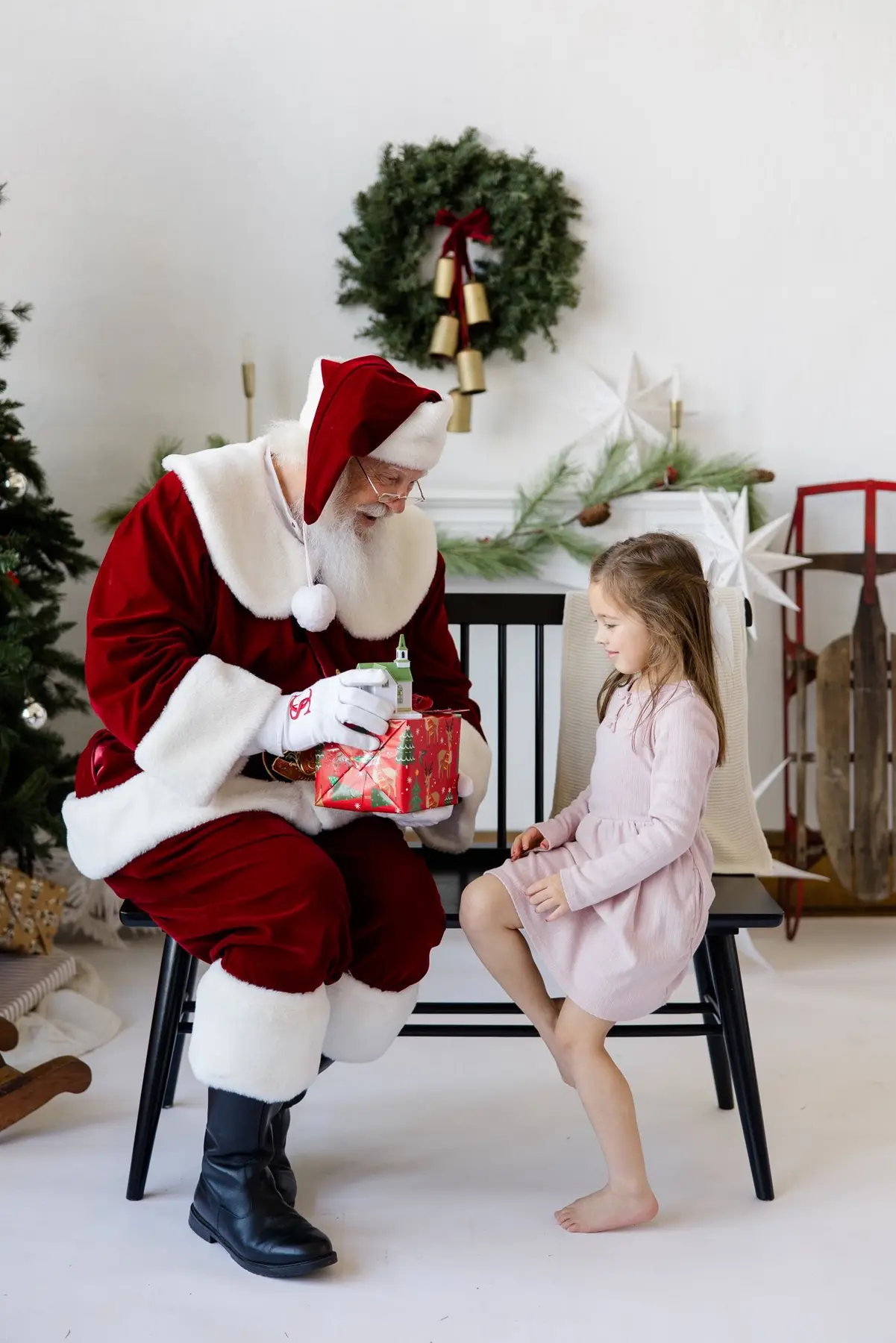 Santa Skip presenting a special Christmas gift to a young girl